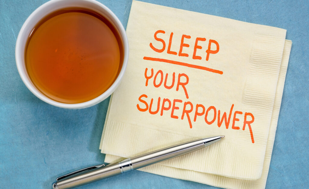 Sleep, your superpower concept - handwriting on a napkin with a cup of tea